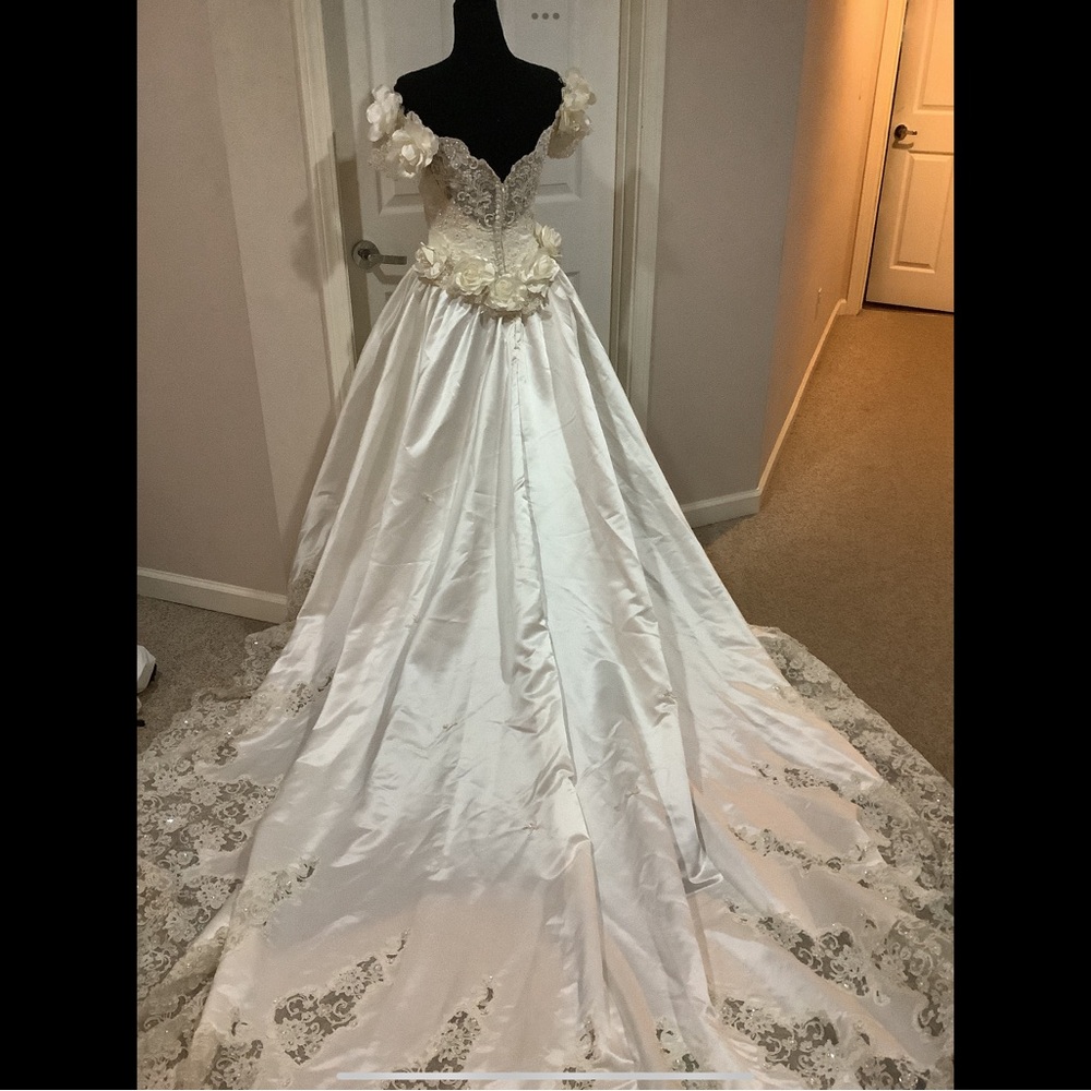 Elegant White Wedding Gown with Floral Details